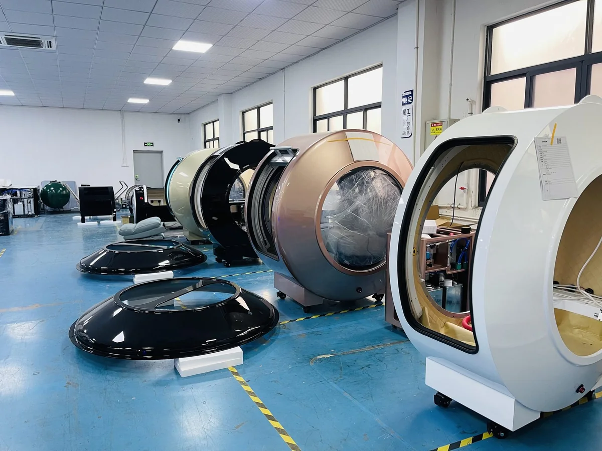 Completed hyperbaric oxygen chambers lined up on the MIND production floor