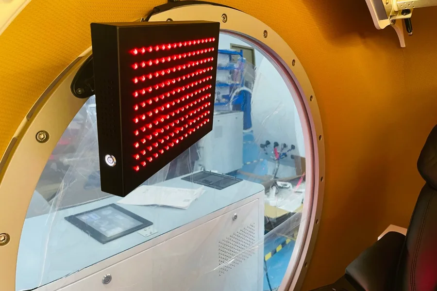 Control module and LED panel fitted behind a chamber viewport