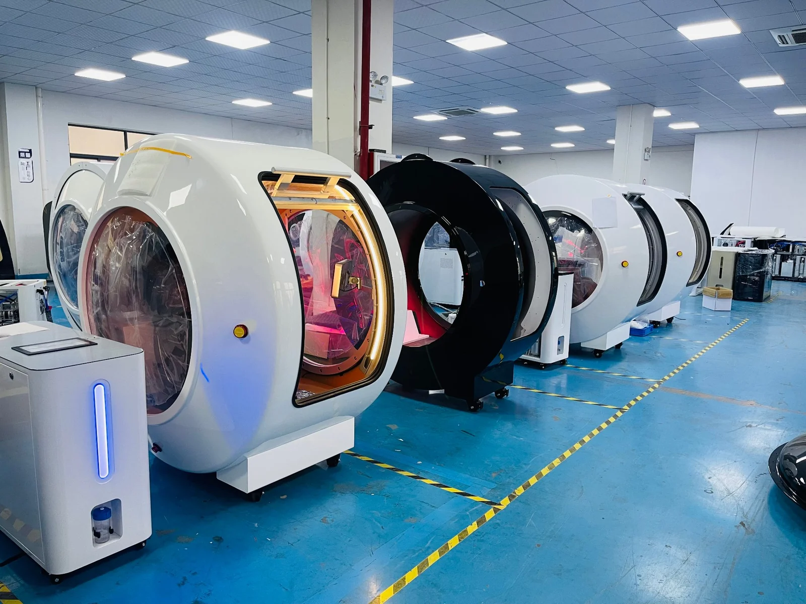 Hyperbaric oxygen chambers lined up for bulk delivery in the MindOXYChamber factory